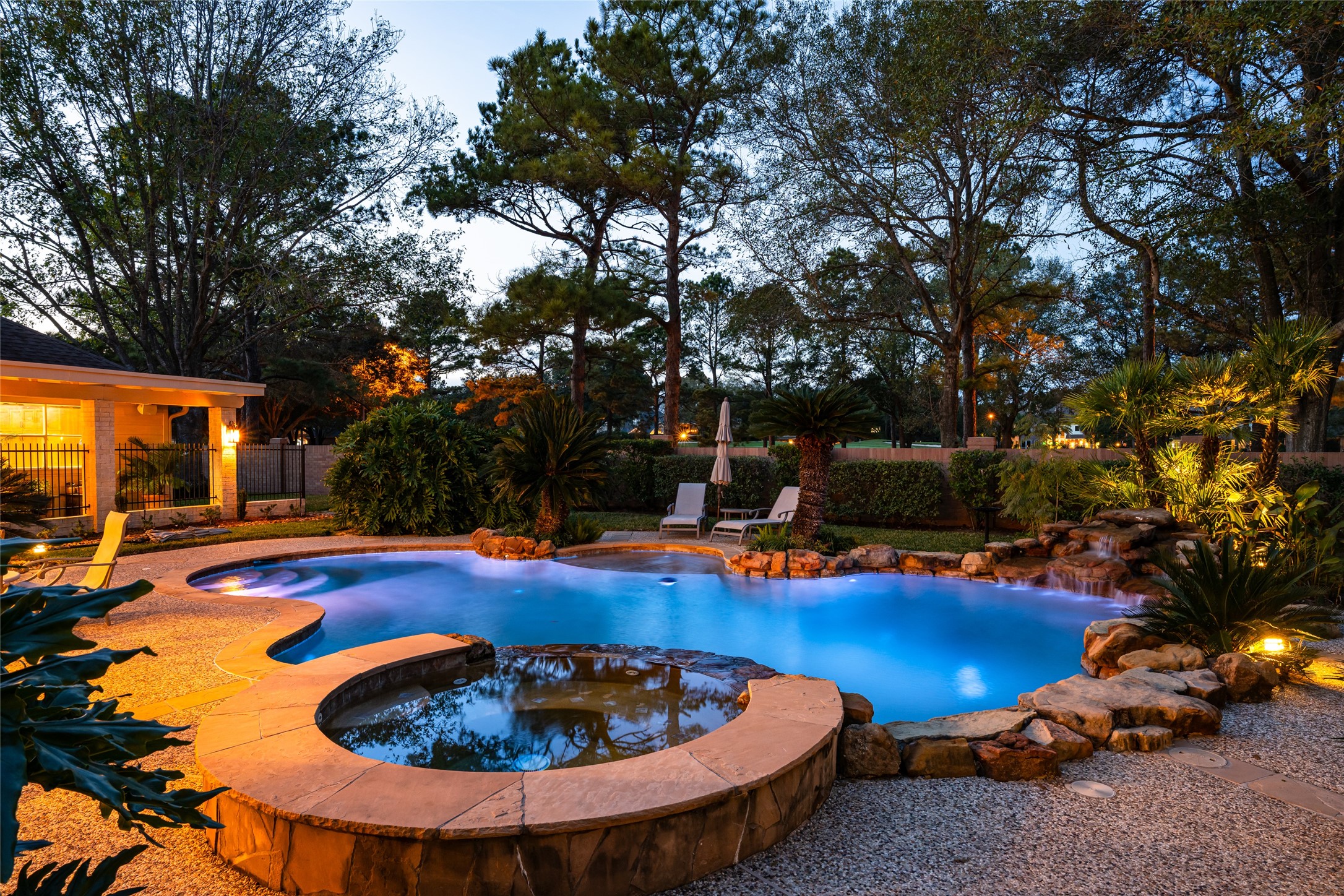 22806 2 Rivers Lane Katy, TX 77450 - Photo 6 of 49 Imagine unwinding in your private hot tub beneath the expansive Texas sky, with no homes behind you...just open views, twinkling stars, and the peaceful glow of the "Eyes of Texas" watching over a quiet beautiful night.