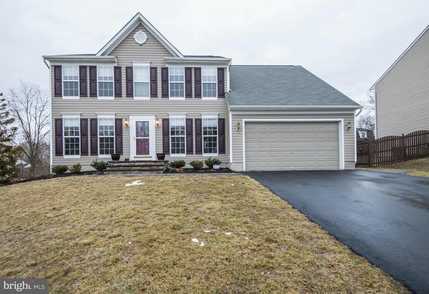 9522 Rommel Drive Columbia, MD 21046 - Photo 1 of 30 a front view of a house with a yard