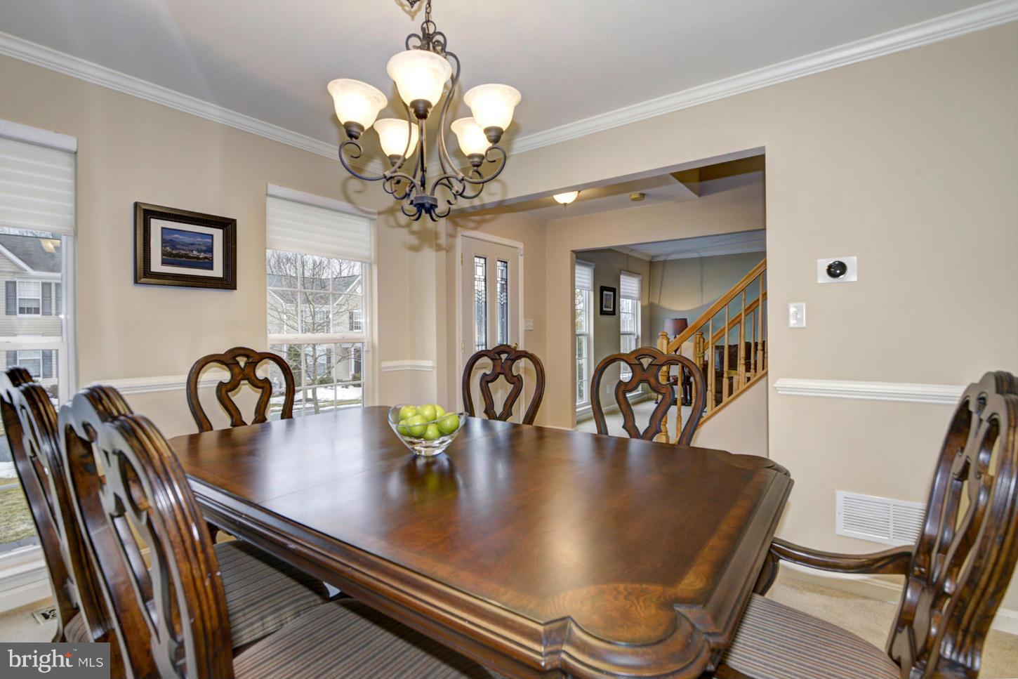 9522 Rommel Drive Columbia, MD 21046 - Photo 11 of 30 a dining room with furniture and chandelier