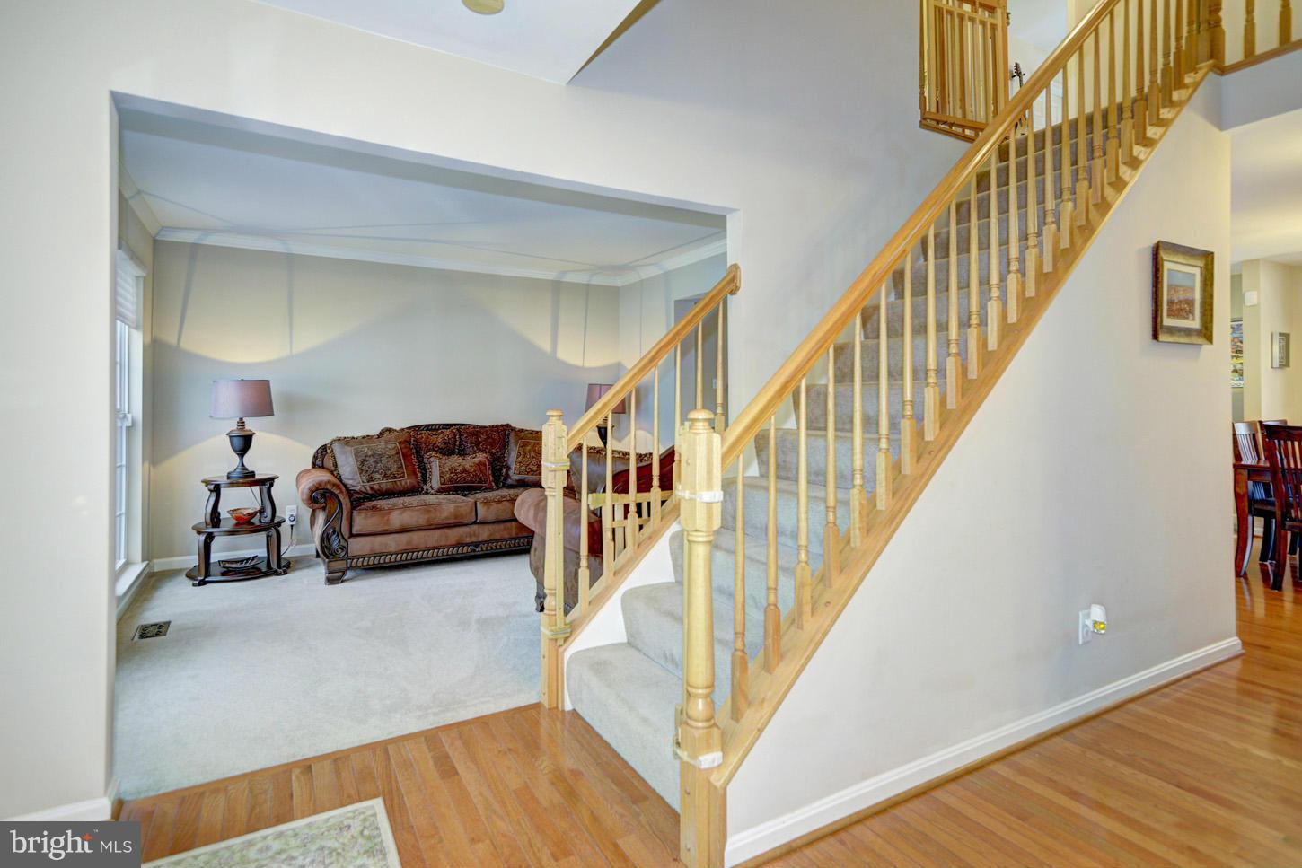 9522 Rommel Drive Columbia, MD 21046 - Photo 16 of 30 a living room with furniture and stairs