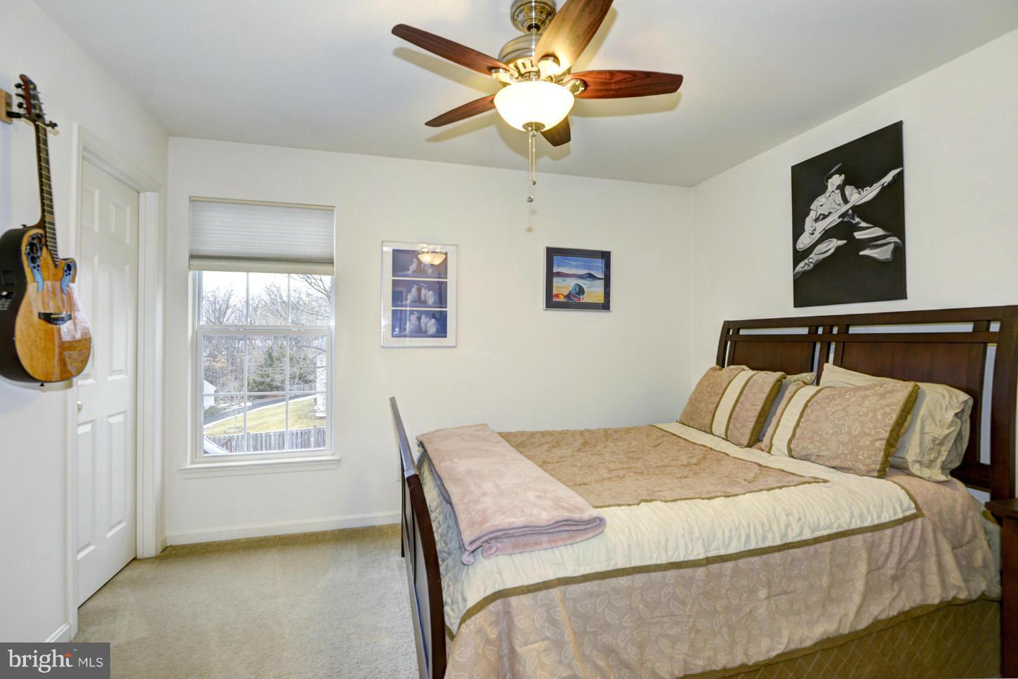 9522 Rommel Drive Columbia, MD 21046 - Photo 22 of 30 a bedroom with a bed and a window