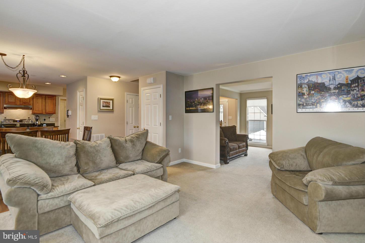 9522 Rommel Drive Columbia, MD 21046 - Photo 9 of 30 a living room with furniture and a large window