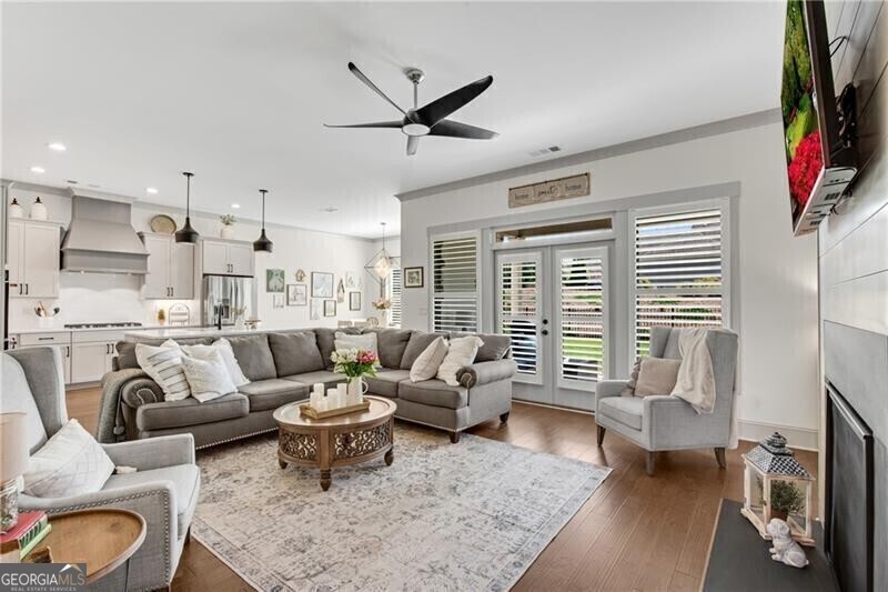 485 Delaperriere Loop Jefferson, GA 30549 - Photo 12 of 69 a living room with furniture flat screen tv and a large window