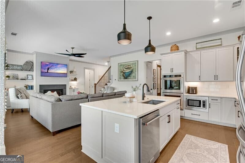 485 Delaperriere Loop Jefferson, GA 30549 - Photo 18 of 69 a kitchen that has a lot of cabinets in it