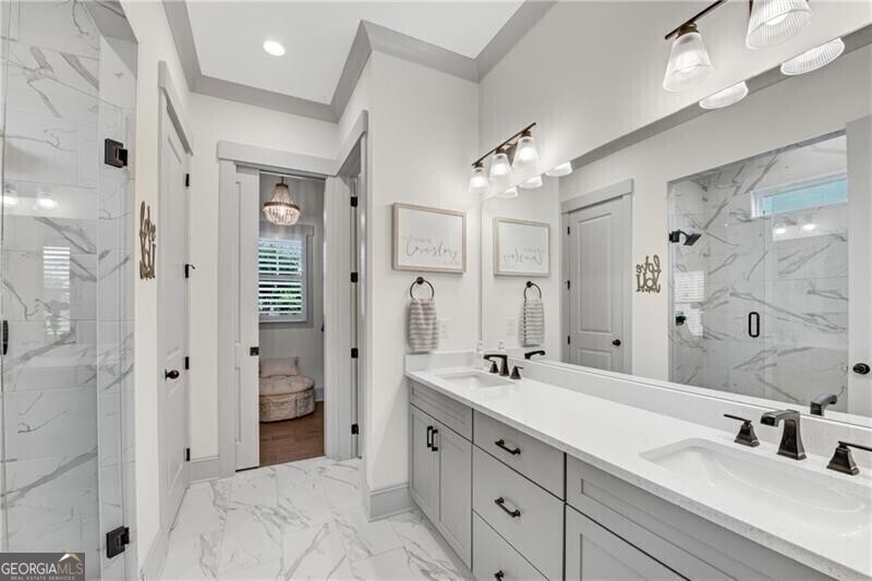 485 Delaperriere Loop Jefferson, GA 30549 - Photo 28 of 69 a spacious bathroom with double vanity a sink a shower and a mirror