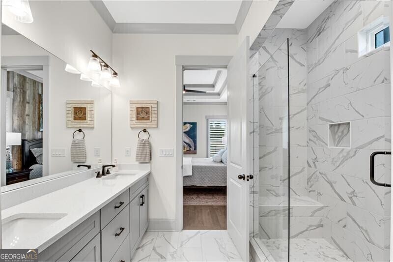 485 Delaperriere Loop Jefferson, GA 30549 - Photo 29 of 69 a spacious bathroom with a double vanity sink a shower and a mirror