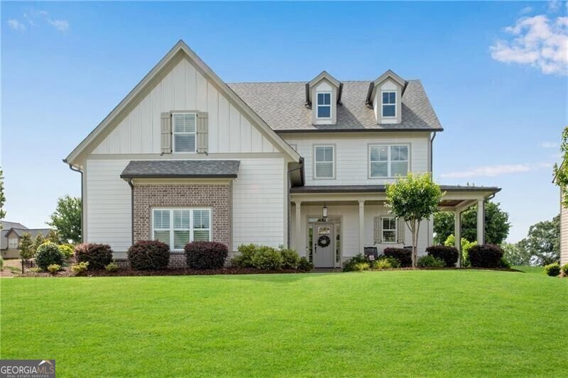 485 Delaperriere Loop Jefferson, GA 30549 - Photo 3 of 69 a front view of a house with a garden