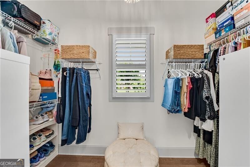 485 Delaperriere Loop Jefferson, GA 30549 - Photo 32 of 69 a view of walk in closet with clothes and shoes