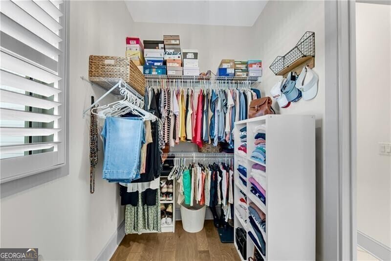 485 Delaperriere Loop Jefferson, GA 30549 - Photo 33 of 69 a view of walk in closet with clothes and shoes