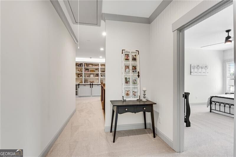 485 Delaperriere Loop Jefferson, GA 30549 - Photo 36 of 69 a view of a hallway with wooden floor and dining room