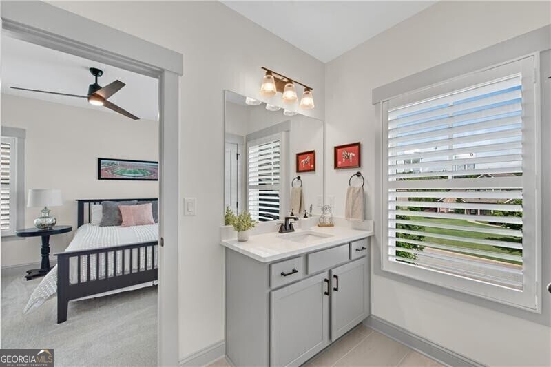 485 Delaperriere Loop Jefferson, GA 30549 - Photo 50 of 69 a bathroom with a sink a vanity and a window