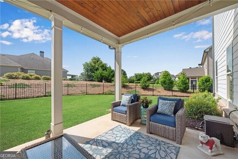485 Delaperriere Loop Jefferson, GA 30549 - Photo 51 of 69 a view of a patio with couches chairs potted plants and a yard