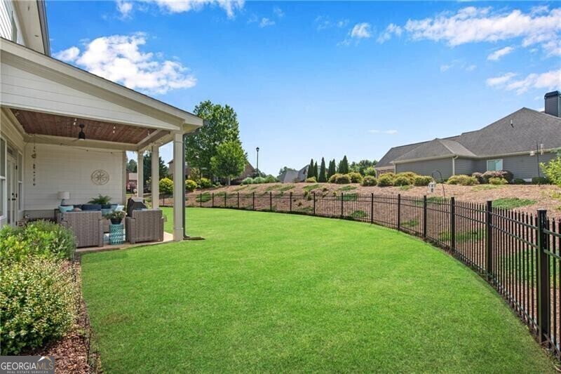 485 Delaperriere Loop Jefferson, GA 30549 - Photo 52 of 69 a view of a backyard with a garden and plants