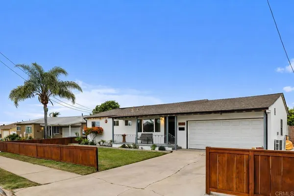 a front view of residential houses with yard