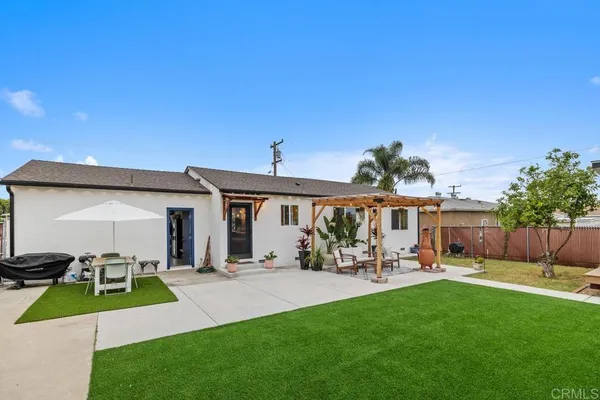 a view of a backyard with a sitting area and slide
