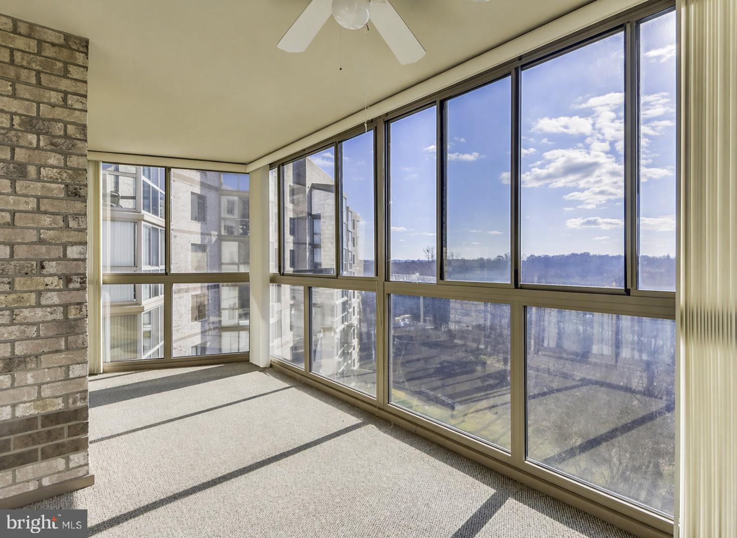 19385 Cypress Ridge Terrace, Unit 920 Leesburg, VA 20176 - Photo 6 of 40 Bright sunroom with scenic views.