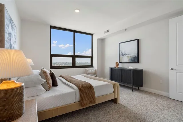 a bathroom with a bathtub shower sink and toilet