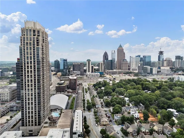 a view of multiple houses with a yard