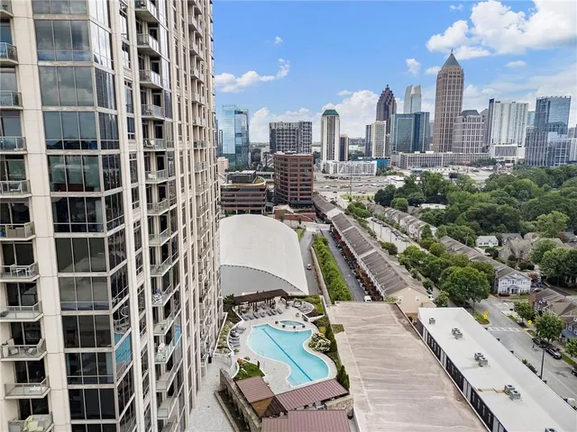 a view of a patio with dining table and chairs with the garden