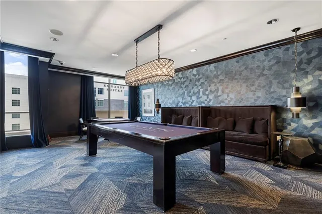 a lobby with furniture and a fireplace