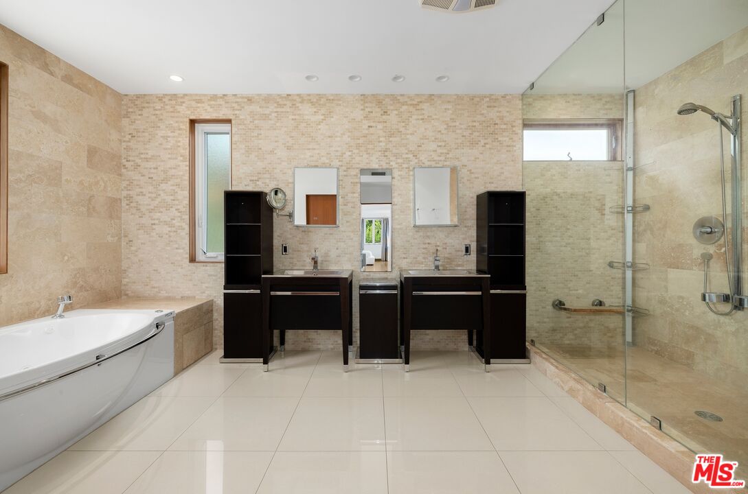 2437 Apollo Drive Los Angeles, CA 90046 - Photo 16 of 27 a large bathroom with a tub sink shower and mirror