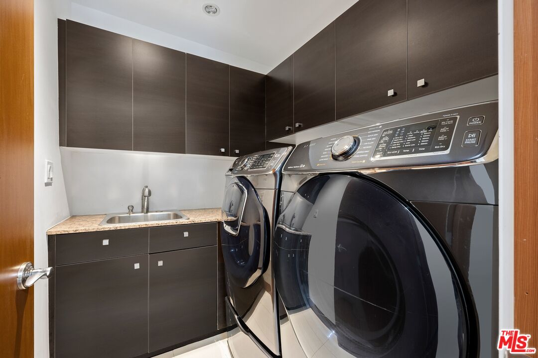 2437 Apollo Drive Los Angeles, CA 90046 - Photo 21 of 27 a utility room with cabinets