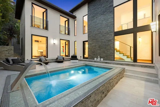 a view of a kitchen with a large window and couch