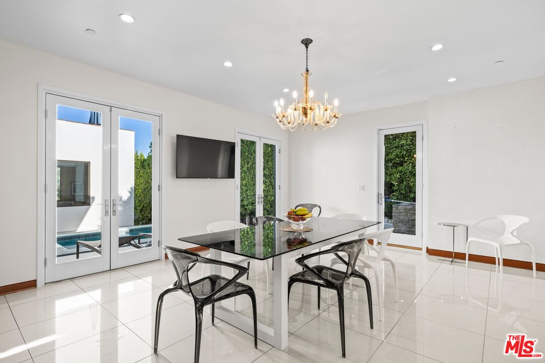 2437 Apollo Drive Los Angeles, CA 90046 - Photo 5 of 27 a dining room with furniture and chandelier