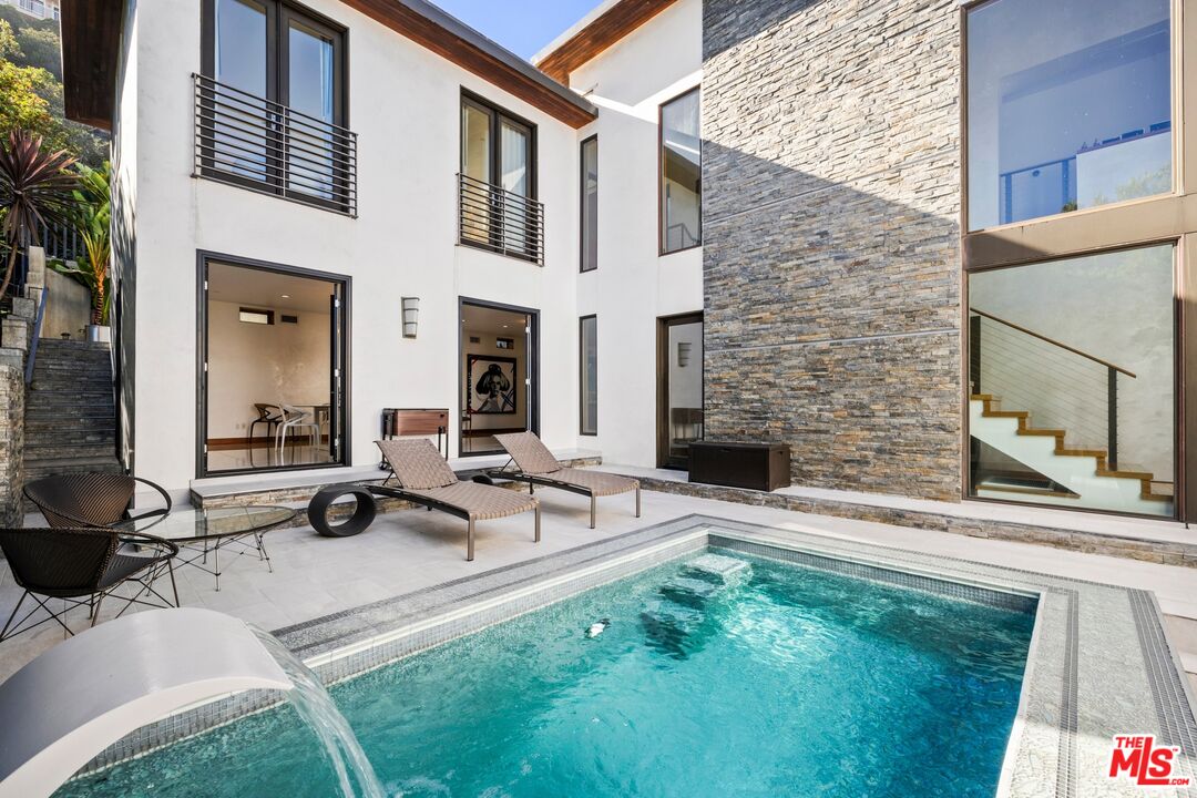 2437 Apollo Drive Los Angeles, CA 90046 - Photo 6 of 27 a view of a patio with table and chairs and potted plants