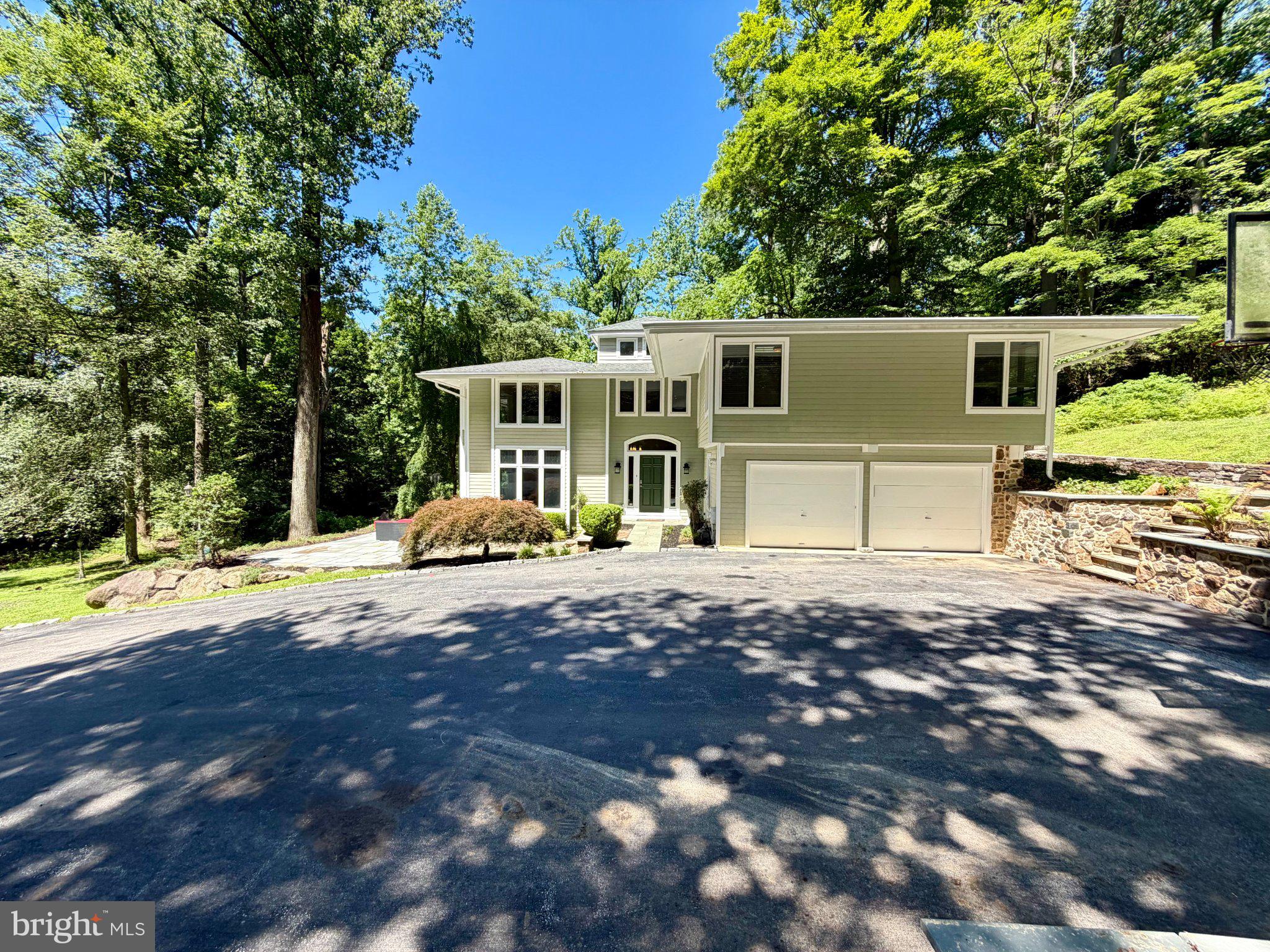 756 Campwoods Road Villanova, PA 19085 - Photo 4 of 38 Modern home nestled in lush greenery.