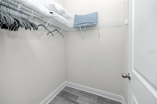 a bathroom with a granite countertop sink a toilet and bathtub