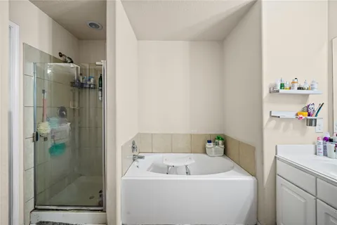 a bathroom with a sink and shower
