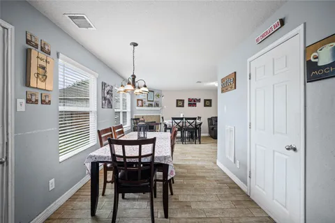 a dining room with furniture and window