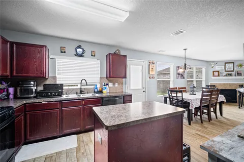 a kitchen with granite countertop lots of counter top space