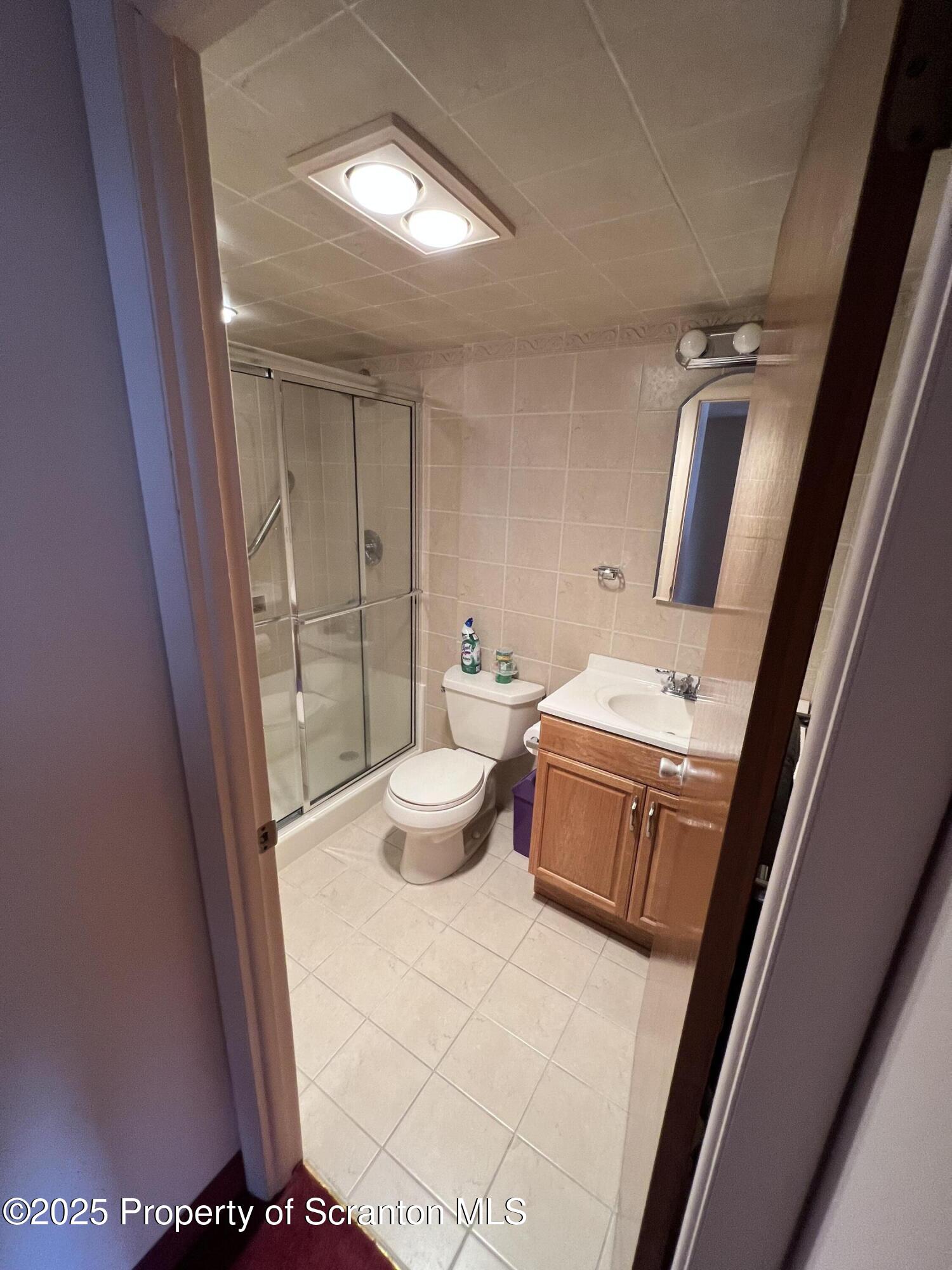 220 Linden Street, Unit 604 Scranton, PA 18503 - Photo 7 of 9 a bathroom with a sink and mirror