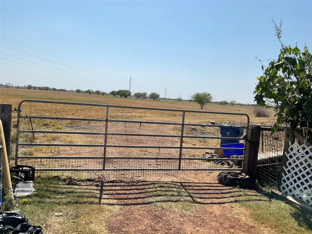 a view of a street with an ocean view