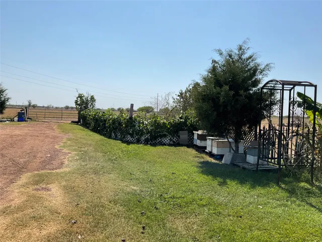 a view of a backyard with sitting area