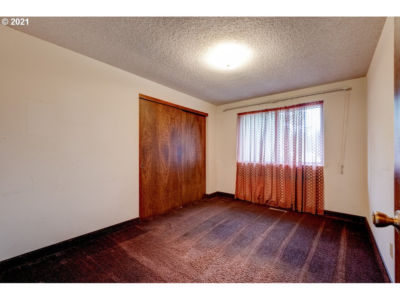 8530 South Barnards Road Canby, OR 97013 - Photo 19 of 22 an empty room with wooden floor and windows