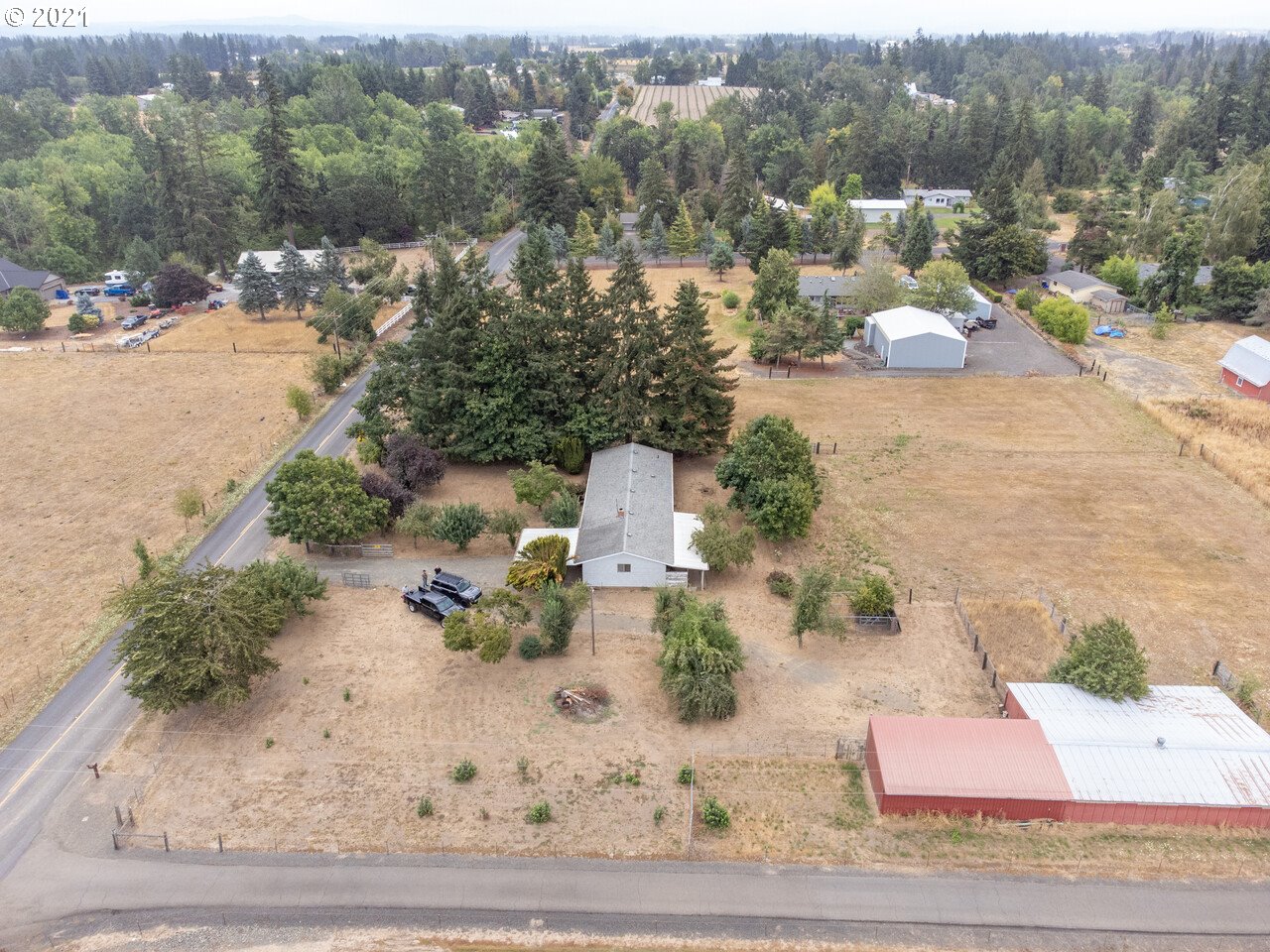 8530 South Barnards Road Canby, OR 97013 - Photo 20 of 22 an aerial view of a house with a yard and lake view