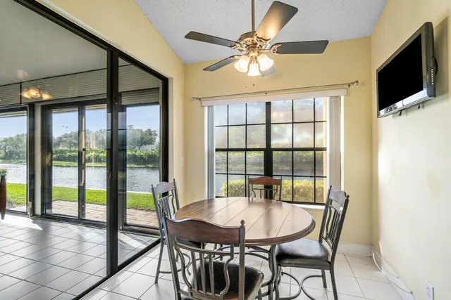 a view of a dining room with furniture window and outside view