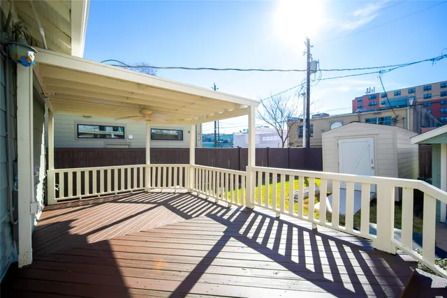 a view of balcony with wooden floor