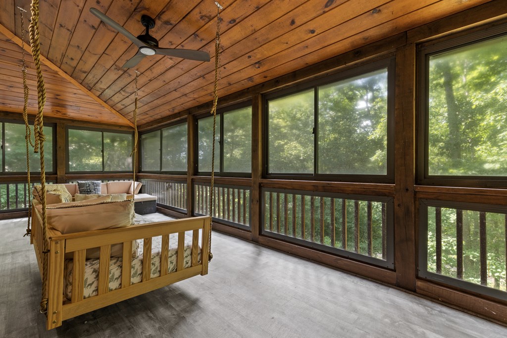 220 Solar Drive Blue Ridge, GA 30513 - Photo 25 of 59 a bedroom with furniture and a large window
