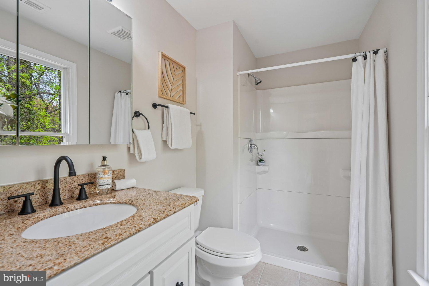 9955 Guilford Road Jessup, MD 20794 - Photo 17 of 45 Bright and airy bathroom with modern touches.