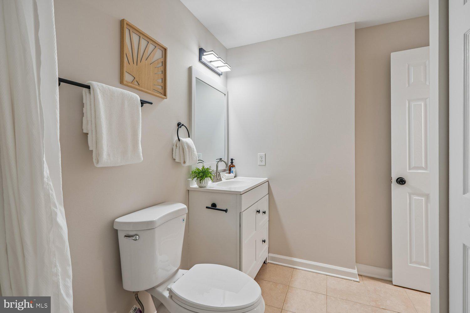 9955 Guilford Road Jessup, MD 20794 - Photo 23 of 45 Modern bathroom with sleek design elements.