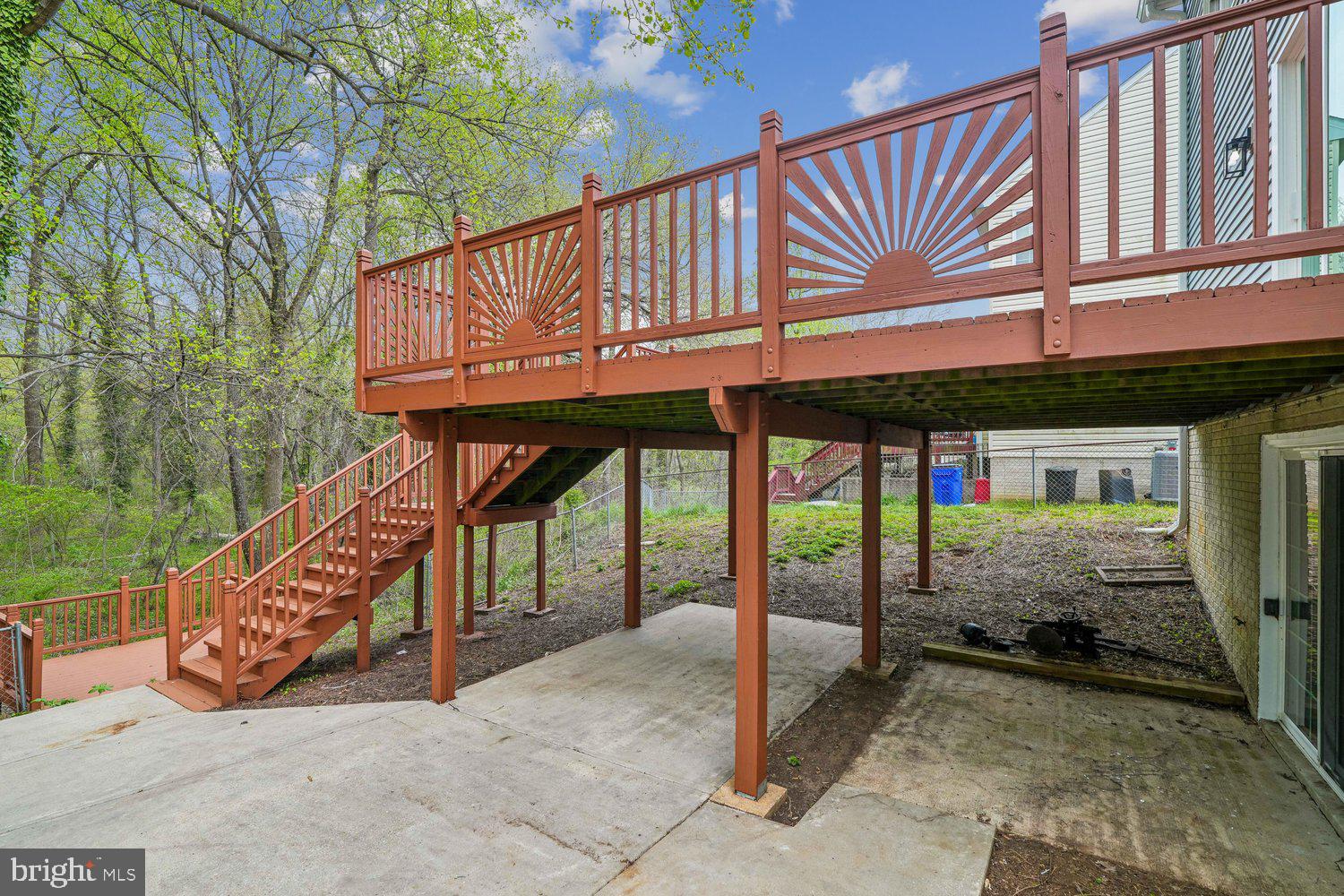 9955 Guilford Road Jessup, MD 20794 - Photo 35 of 45 Charming deck nestled in a serene landscape.