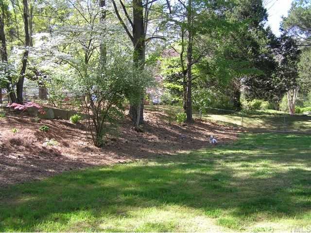 3015 Brentwood Road Raleigh, NC 27604 - Photo 12 of 12 a backyard of a house with lots of green space
