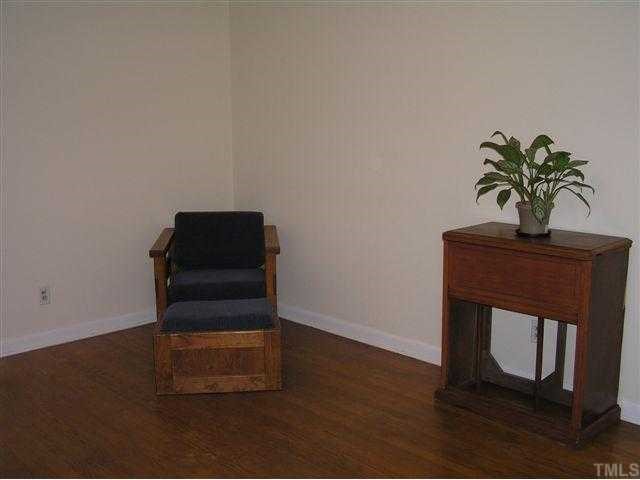 3015 Brentwood Road Raleigh, NC 27604 - Photo 6 of 12 a room with a potted plant on a table