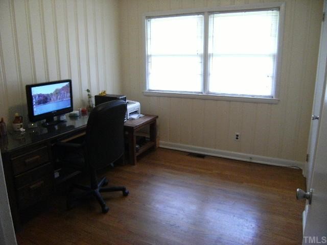 3015 Brentwood Road Raleigh, NC 27604 - Photo 8 of 12 an empty room with a window