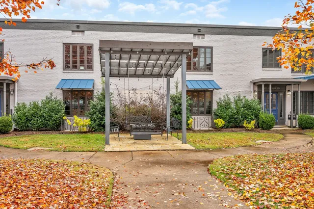 a view of a brick house with a large windows