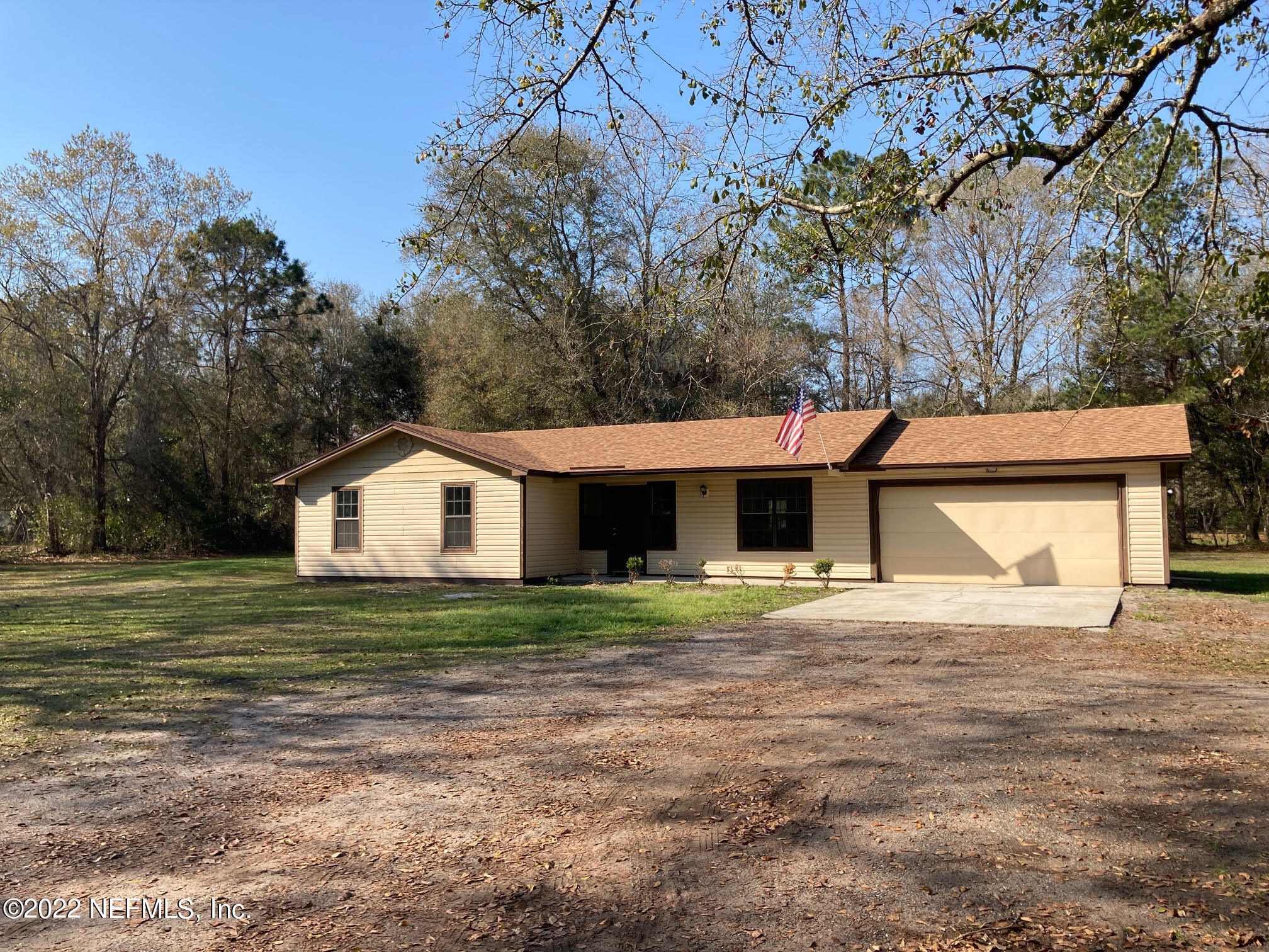 3970 Pinto Road Middleburg, FL 32068 - Photo 1 of 53 a big house with a big yard and large trees